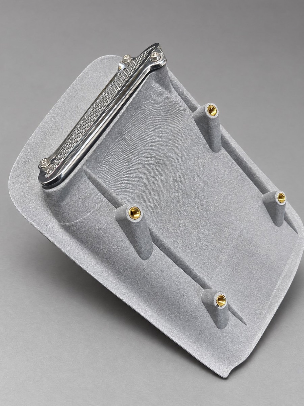 Back plate of a grey nylon vintage-car air duct with heat-set threaded inserts