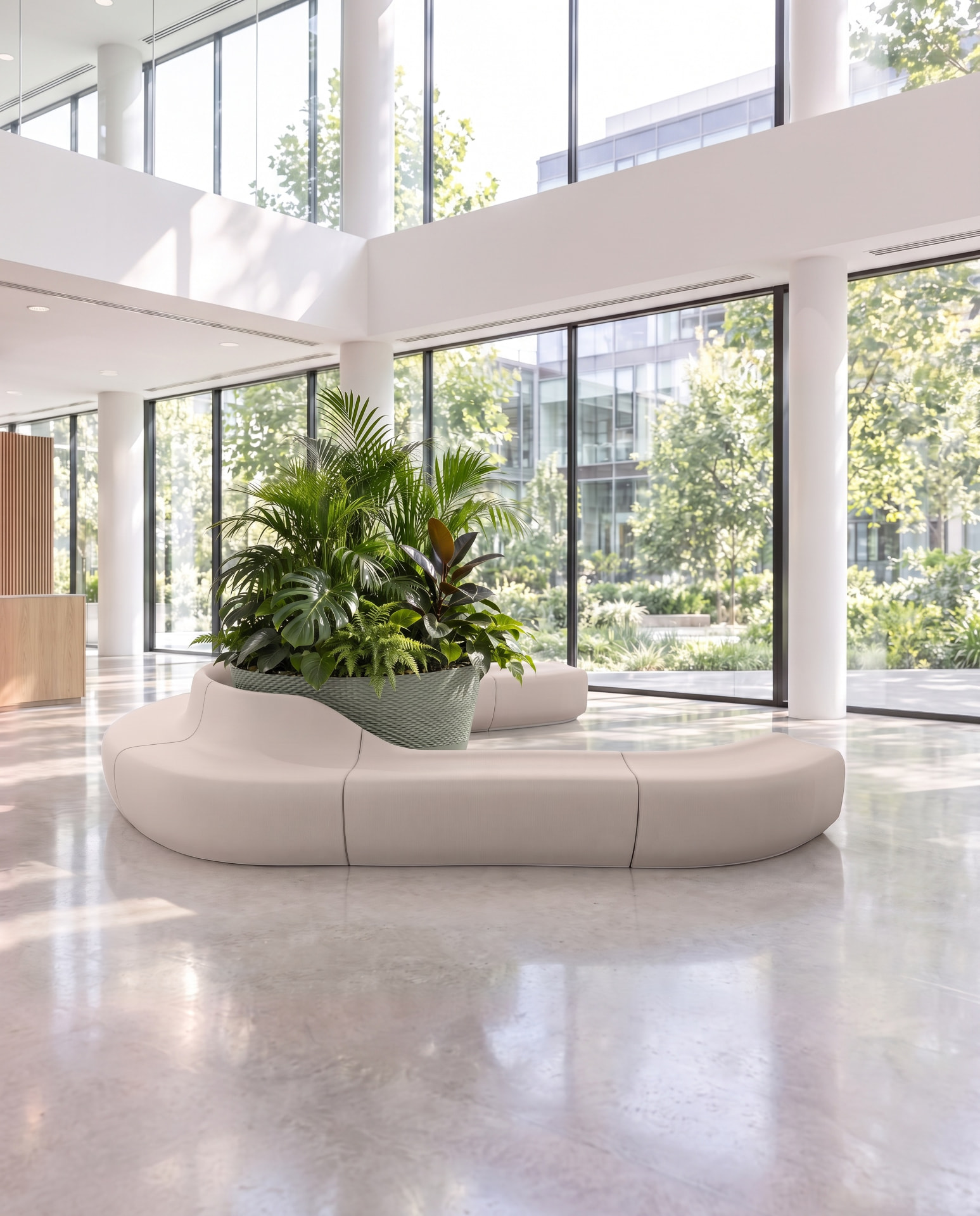 A printed bench with a built-in planter full of plants in a building lobby
