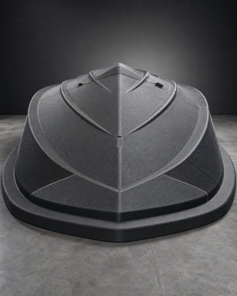 A large black LFAM-printed mold at end of life