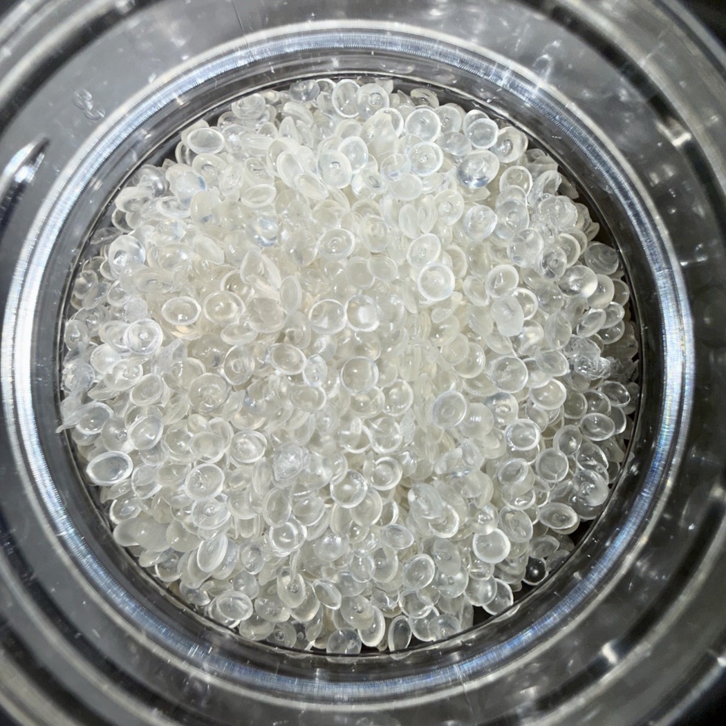 A dish of recycled PLA pellets
