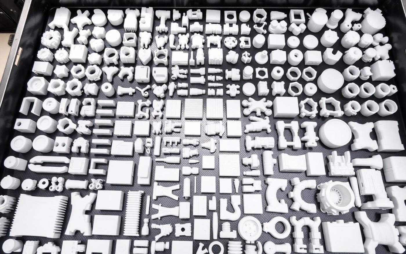 A tray of hundreds of finished printed parts