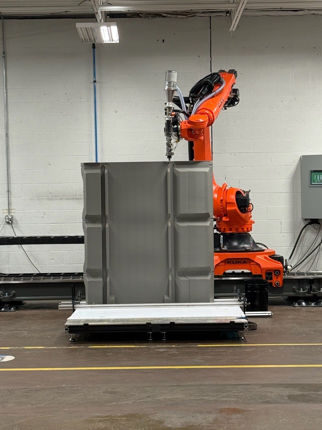 A robotic arm printing a large-format part