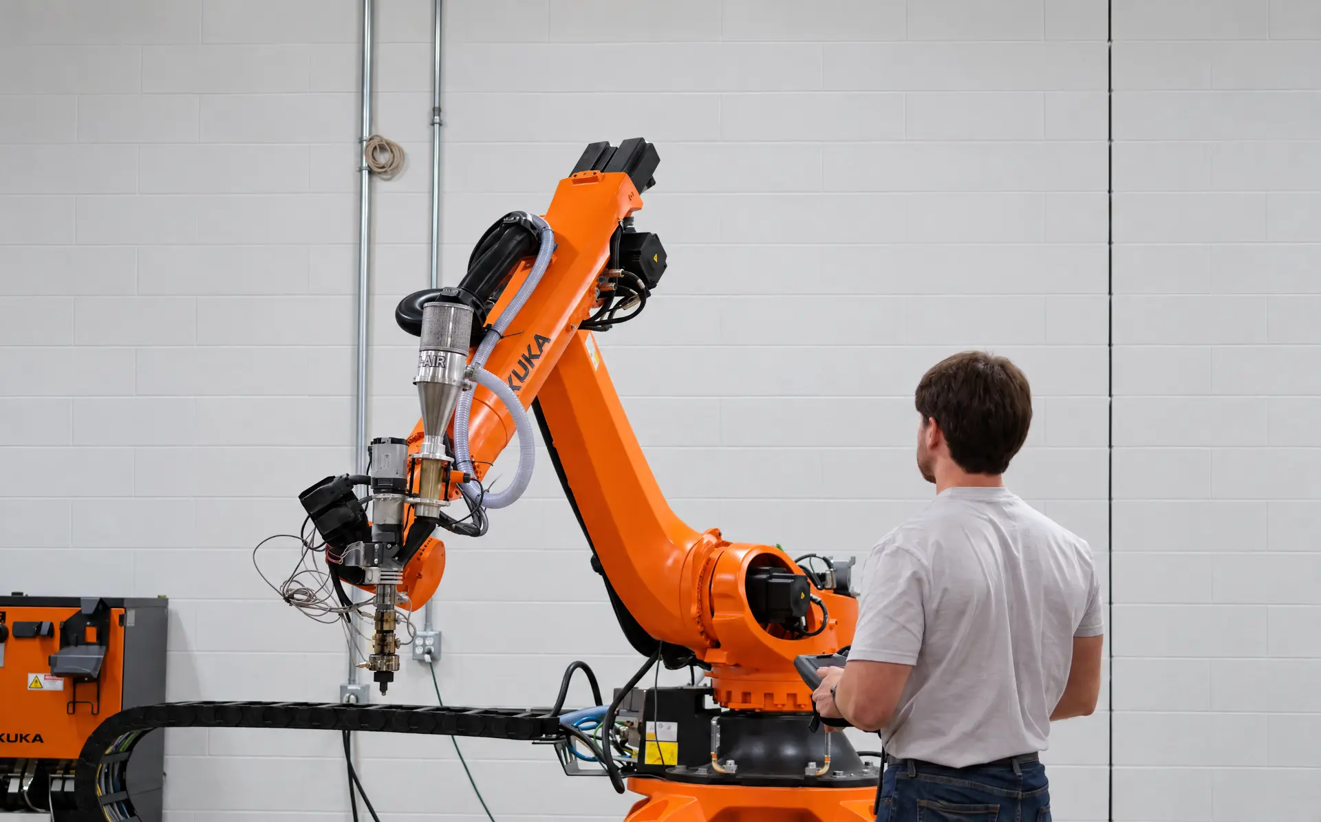 Printerior team member operating a robotic production cell