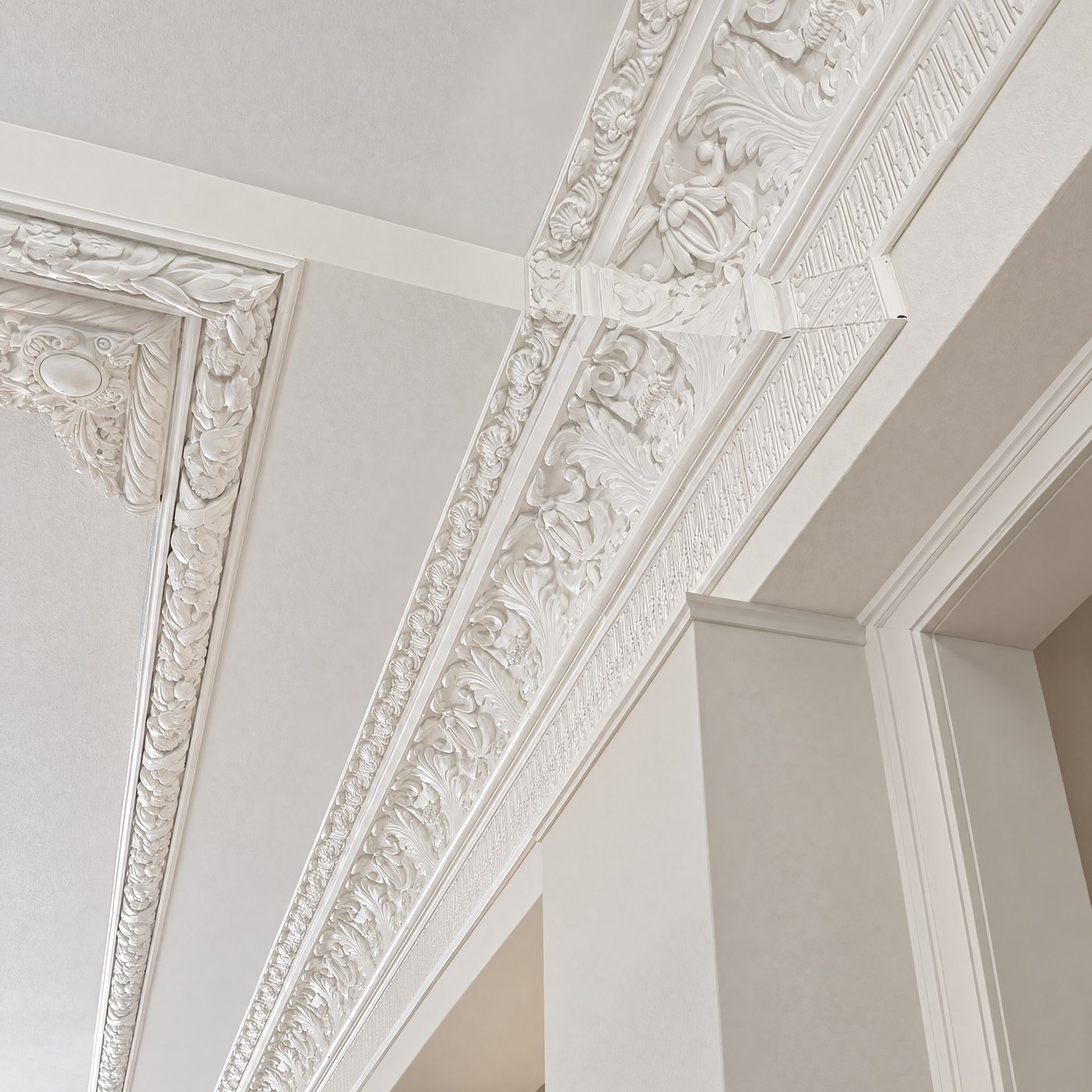 Restored crown molding running along the historic building's ceiling