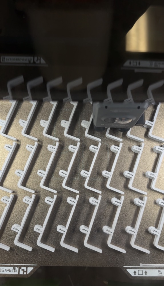A full build plate of identical brackets