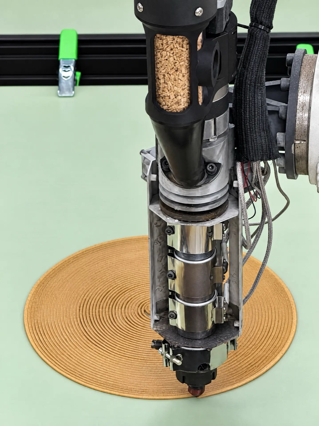 A pellet extruder printing a part