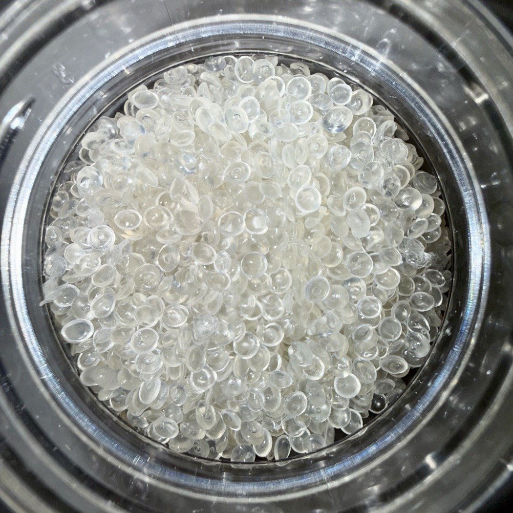A dish of recycled PLA pellets