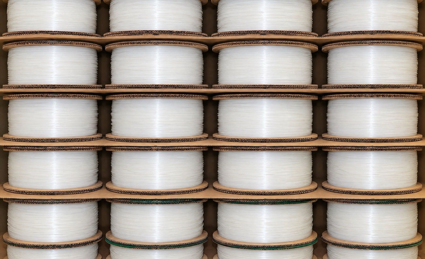 A wall of recycled filament spools