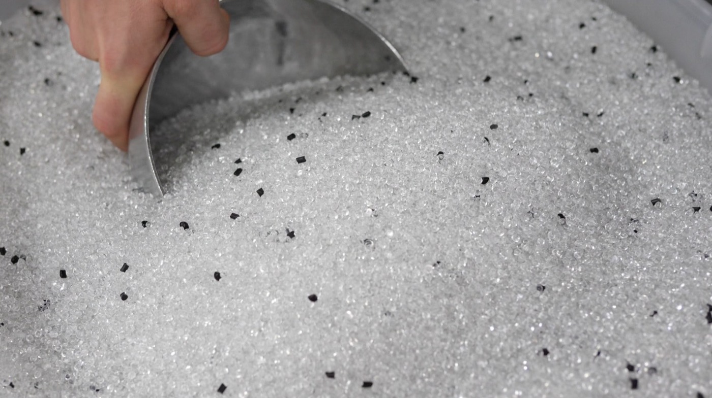 A scoop of recycled pellets